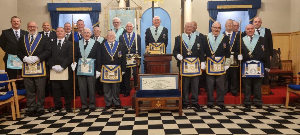 Members of Oakeswell Lodge No. 8117, a Freemasons lodge in the West Midlands, pictured together in the lodge room in ceremonial dress